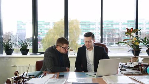 Two Men Working in Modern Office Environment