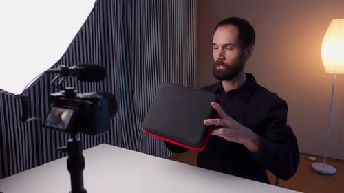Excited Male Content Creator Sharing Feedback on Teleprompter Filming Live Stream on Camera with