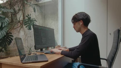 Programmer Coding Both on PC and Laptop in Home Office