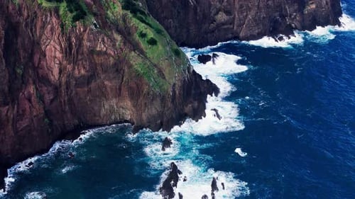 Cliffside Ocean Scene Aerial View of Rugged Coast and Crashing Waves