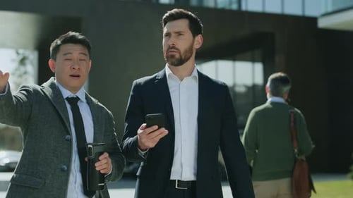 Close Up Two Attractive Business Men Walking Talking Discussing on Street in Modern City Near