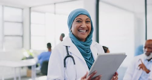 Tablet, healthcare and happy muslim woman doctor in hospital for telehealth