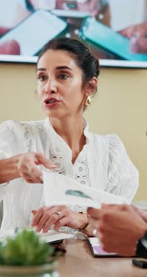 Business, woman and discussion with paperwork in meeting for data analysis