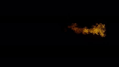 Ignite Collection: Flames of small size escape rapidly from bottom center on dark background shot in
