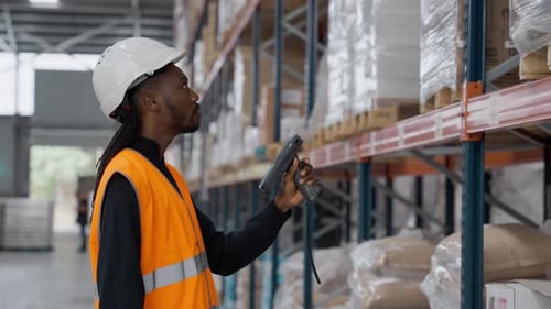 Warehouse Worker Scanning Packages in Slow Motion
