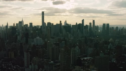 Downtown manhattan skyscrapers bathed in sunlight a New York City aerial view