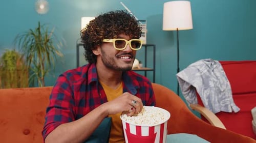 Young Adult Watching Movie With 3D Glasses