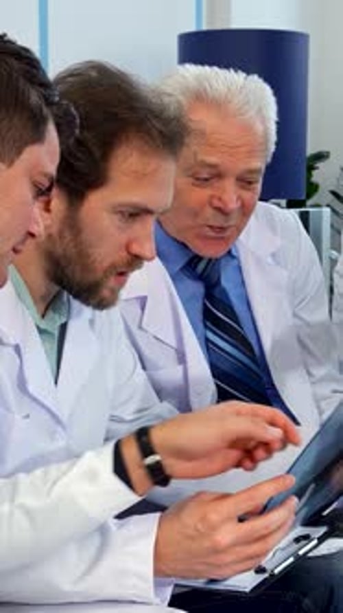 Medical Professionals Examine X-Ray in Hospital Office