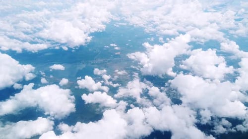 Airplane flight. Flying above the clouds. View from the window of the plane. Traveling by air