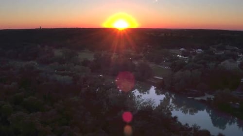 Sunset Over Green Hills and River by Aerial Drone Aerial