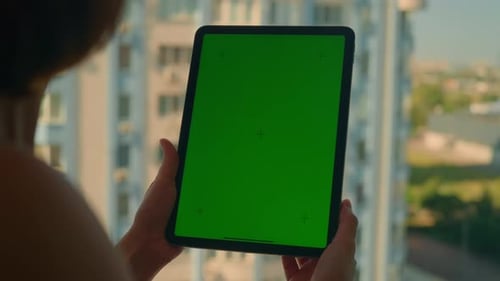 Lady Holding Device with Green Screen