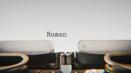 Old mechanical typewriter typing Romantic Moments in a close-up view.