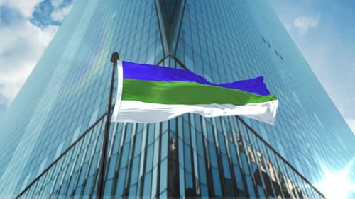 Waving Flag Animation Against Modern Corporate Skyscraper Background