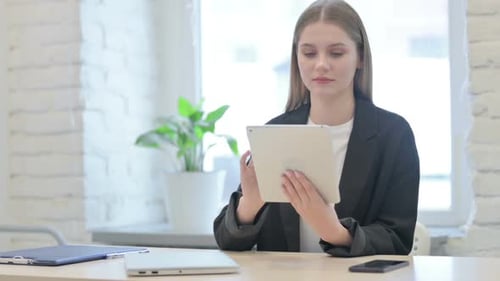 Businesswoman Having a Video Call on Tablet