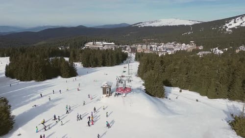 Alpine Ski Lift Aerial Drone View in Kopaonik Serbia Chairlift at Ski Resort Mountain Winter Forest