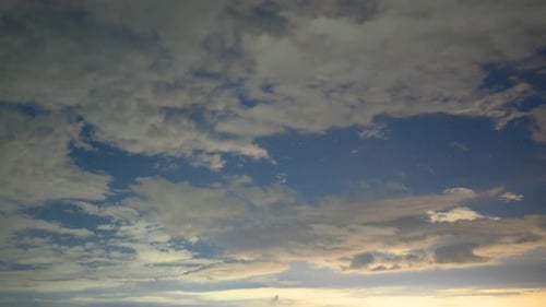 Clouds Flowing Across Starry Night Sky Timelapse
