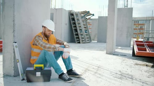 Construction Worker Taking a Break on Site