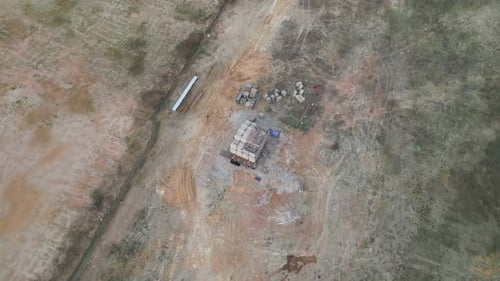 Construction site in the middle of dry field