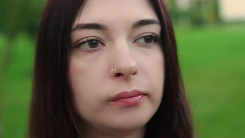 Closeup View of Pretty Caucasian Woman Eating Food Chewing It Carefully and Swallowing