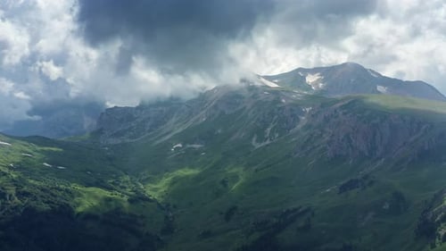 Aerial View of Green Mountain Range with Clouds