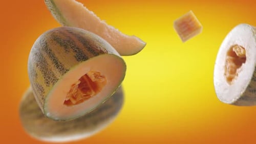 Cantaloupe Pieces Floating on Colorful Background