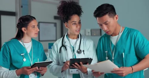 Teamwork, documents and doctors on tablet in hospital for research, diagnosis advice