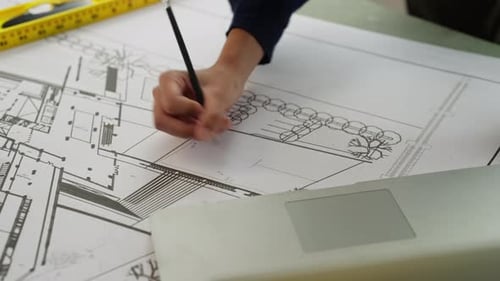 Architect Drawing Blueprint Design at Workplace