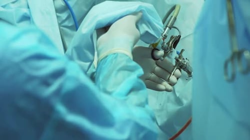 Crop Surgeon Doing Laparoscopic Operation