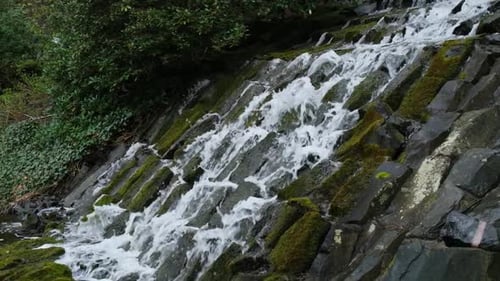 Slow Motion Footage of Flowing Waterfall Closeup Showing the Movement of Water Mountain Waterfall