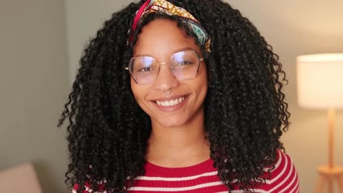 Smiling Young Woman Wearing Glasses and Headband