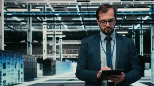 Portrait of Data Center Engineer Monitors System Performance Using AR Simulation