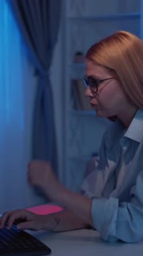 Woman Working at Computer Late at Night