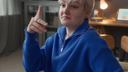 Woman Talking and Gesturing Indoors