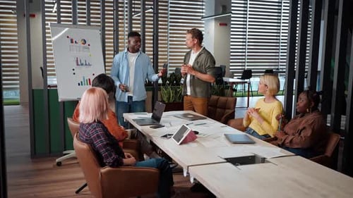 Professionals Collaborating During a Meeting in Modern Office