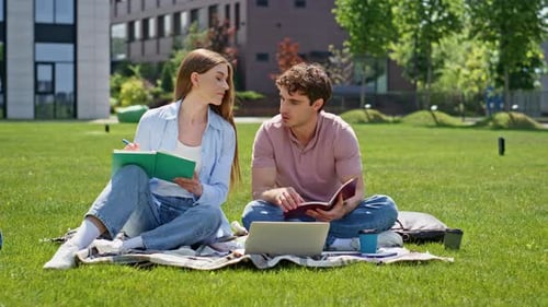 Smiling Couple Learning Nature Sitting Green University Campus Lawn Two Friends