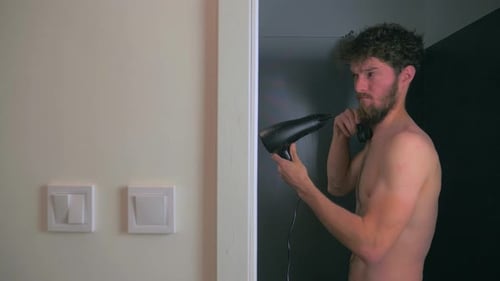 Man Uses Hair Dryer as Telephone