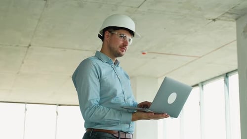Civil Engineer Working Onsite Using Digital Tools