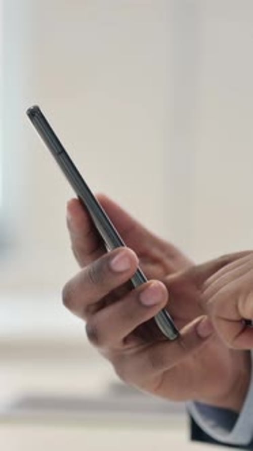 Hands of Businessman Typing on Smartphone, Close up, Vertical Video
