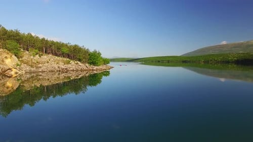 The group has fun in a canoe on the a beautiful lake.