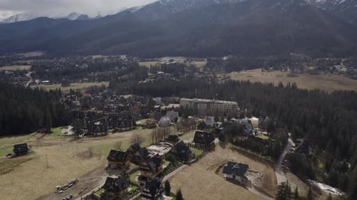 Aerial Footage of the Small Village in Mountains in Sunny Day