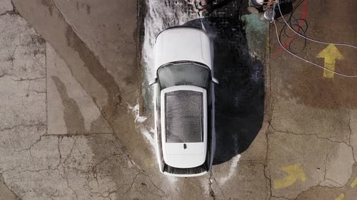 Aerial View of Car Receiving Wash at Carwash