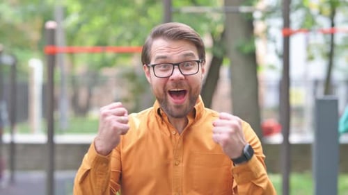Man Reacts with Elation and Success