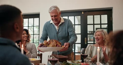 Thanksgiving, turkey and applause with family in dining room for festive holiday