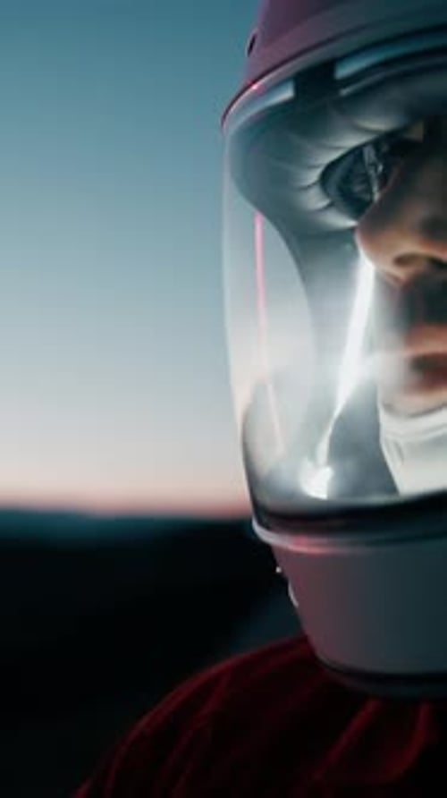 Astronaut With Helmet Explores New Desolate Planet At Night Out Of Spaceship