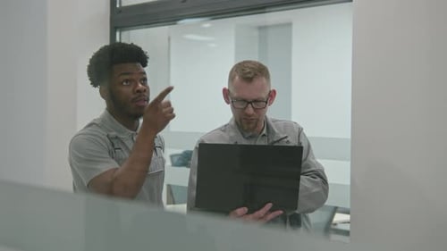 Installers Sets Up Security Cameras in Office