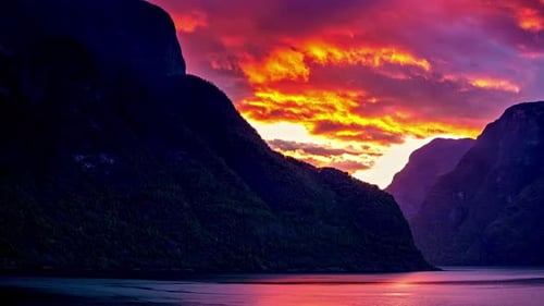 Dramatic Sunset Cloudscape At A Lake With Epic Mountains