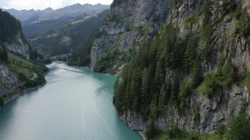 Beautiful Turquoise Lake Winding Through Green Mountains