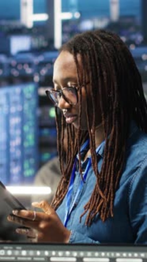 Vertical Video Woman in Server Hub Using AI Visualization Insights on Tablet Device