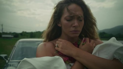 A Deeply Emotional Moment in Nature A Woman Dressed in White Embraces Her True Feelings