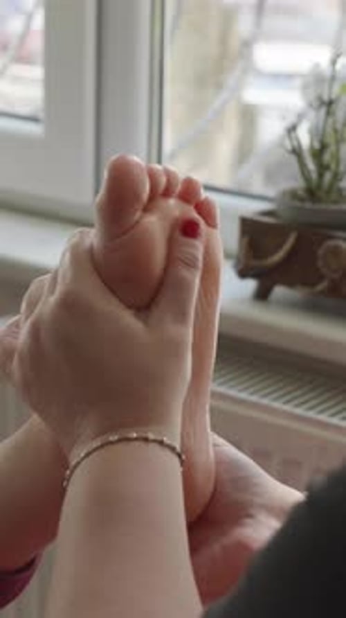 Vertical Close Up of Oily Foot Sole Massage